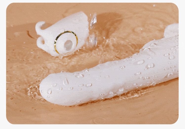 NovaSync Divine Whisper rabbit vibrator being rinsed under running water
