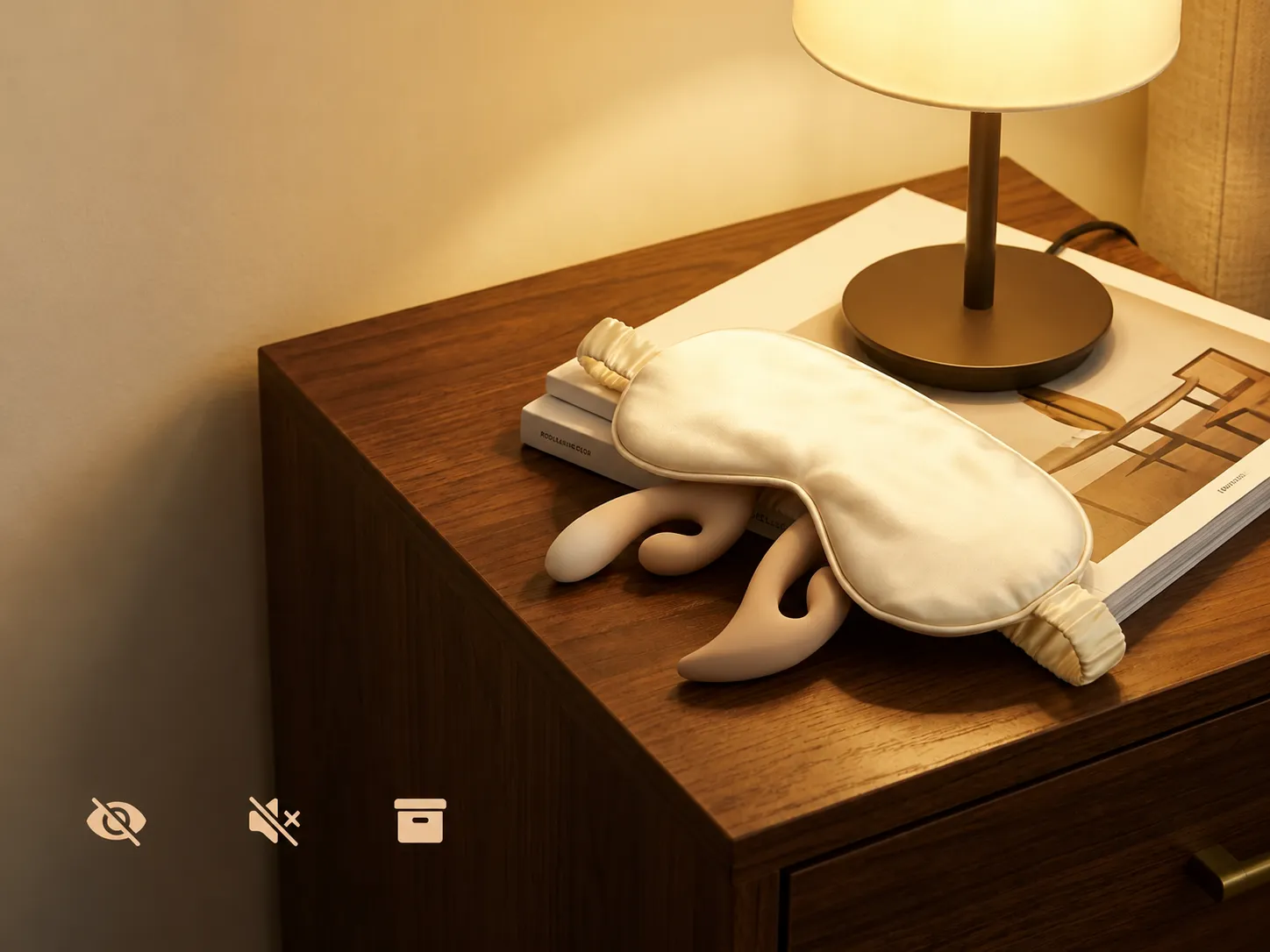 Moran rabbit vibrator on a bedside table with a silk eye mask, showing discreet design and easy storage