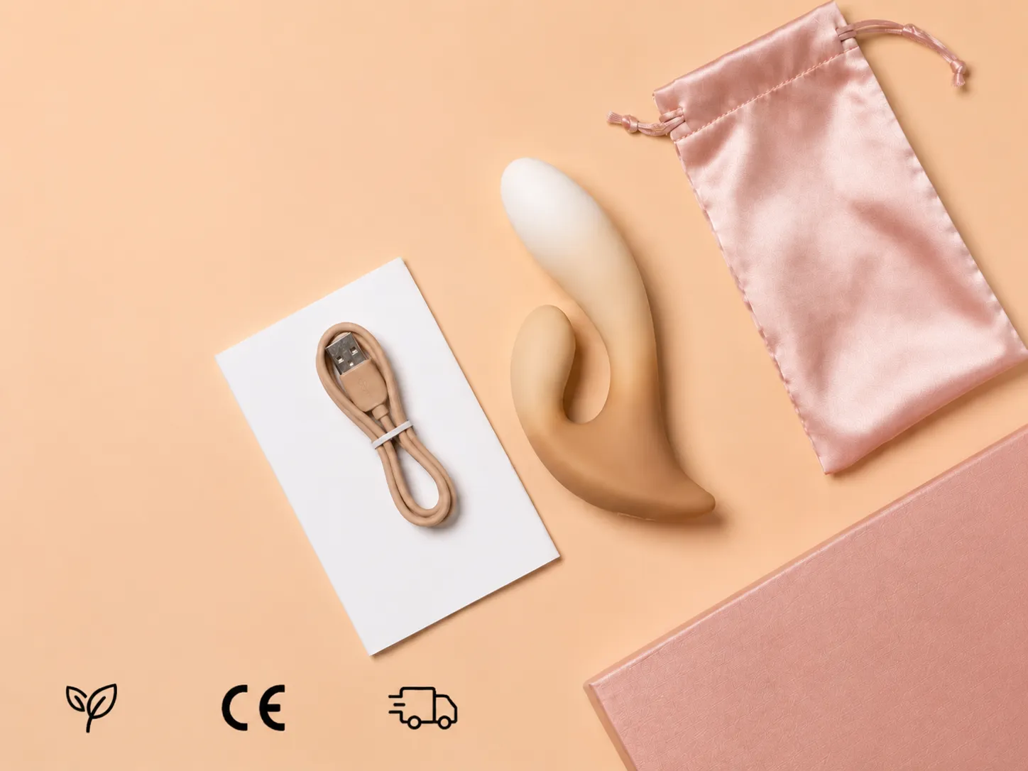 Moran rabbit vibrator flat lay with USB magnetic cable, user manual, satin pouch and gift box