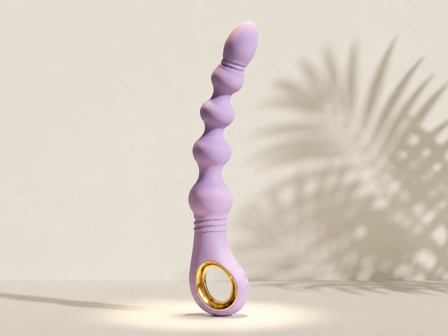 CoreSeal Cascade beaded anal vibrator in soft lavender silicone with graduated beads and gold ring handle