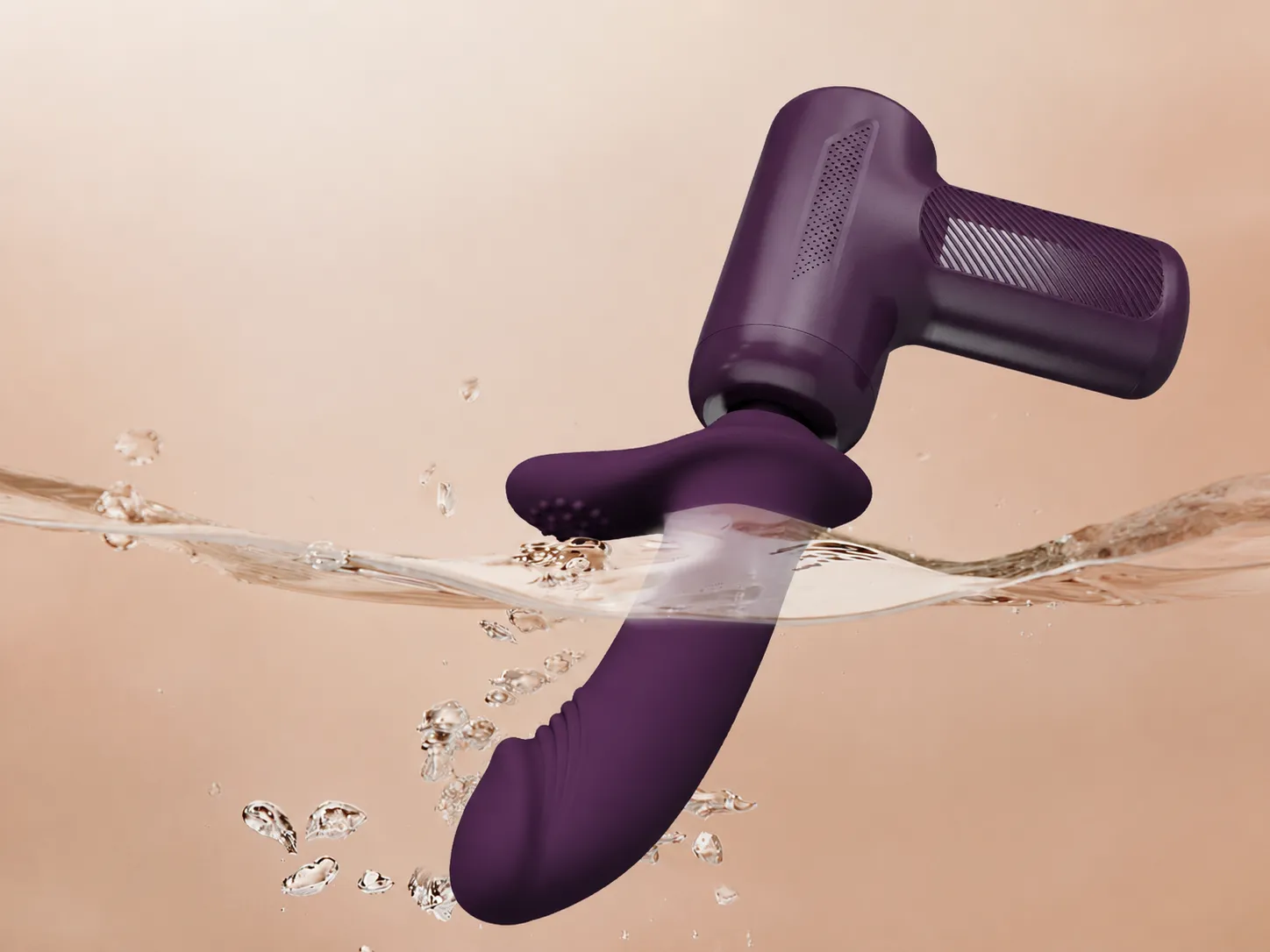 Silicone attachment head of a thrusting massager rinsed under water while the motor handle stays above the surface